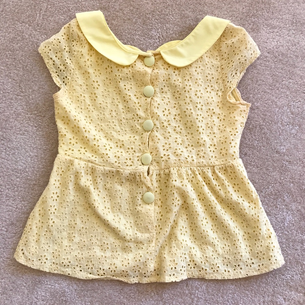 top in very fresh color; buttons at the back.